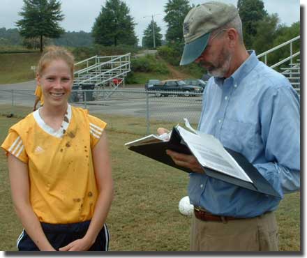 Serious coach, muddy player