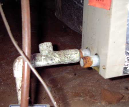 An uncapped A/C drain leads to termite infestation