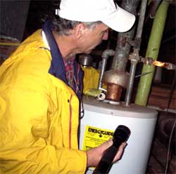 Dan Curl inspects the water heater - Comprehensive Home Inspections Atlanta, GA